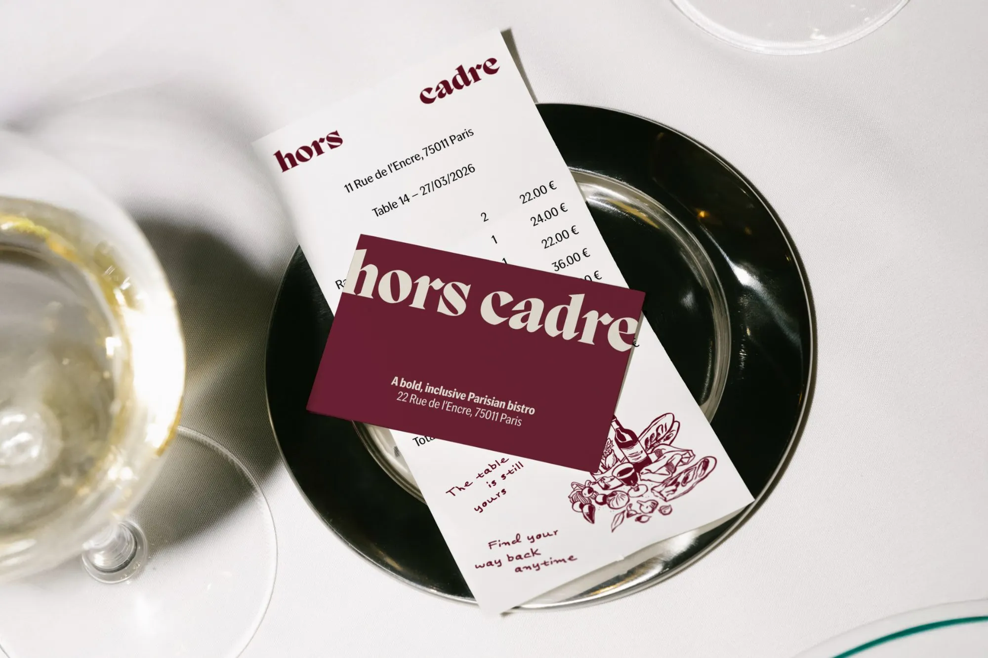 Hors Cadre receipt and business card on a silver plate