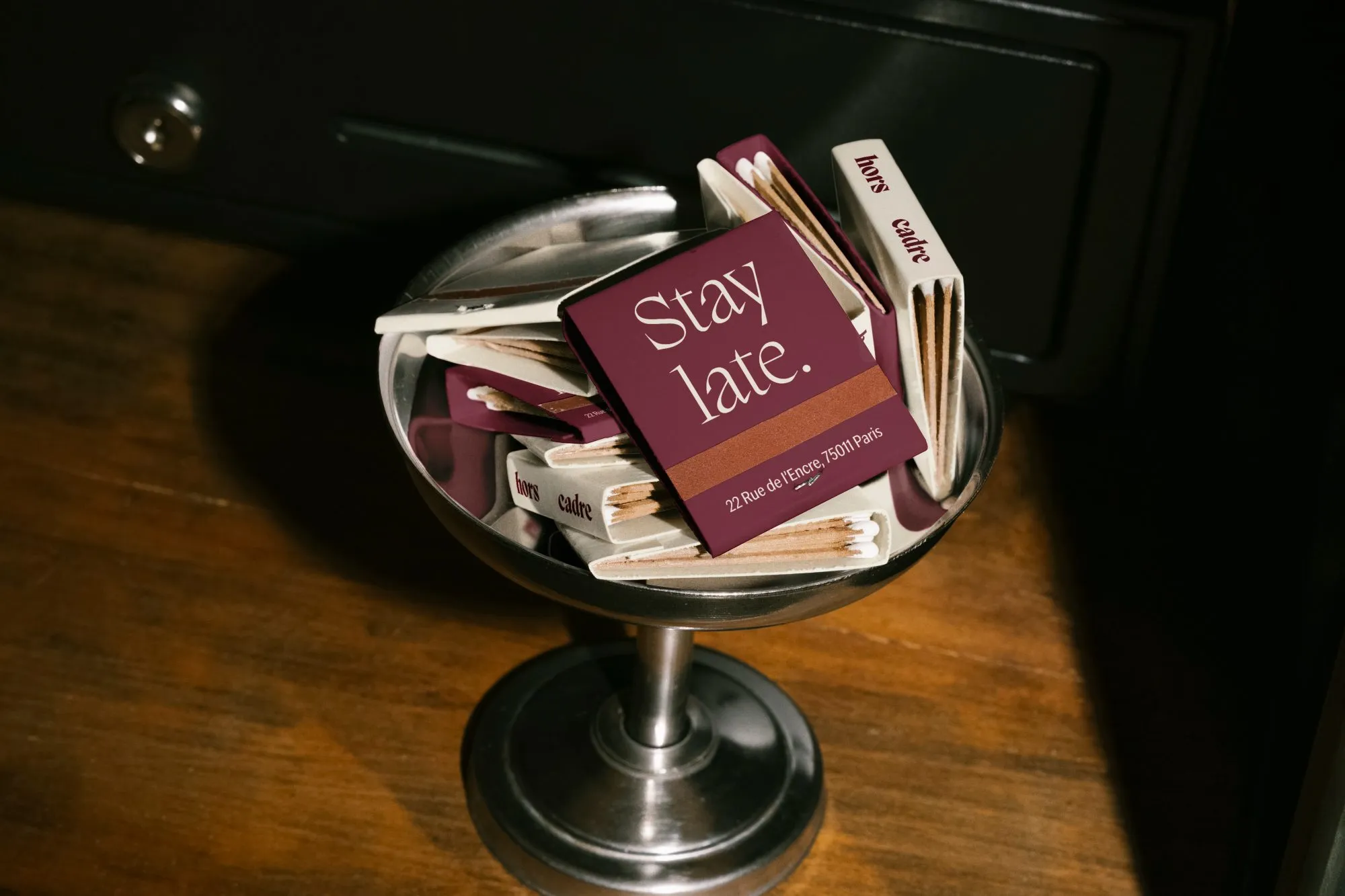 Bowl of Hors Cadre matchbooks reading Stay late